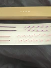 Vintage Avon 2 Pack Double Illusion Head Bands Pink Purple Box. Fixed Price $14.00.